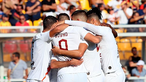 Roma's Edin Dzeko, center, back to camera, celebrates with his teammates after scoring during the Italian Serie A soccer match between Lecce and Roma at the Via del Mare stadium in Lecce, Italy, Saunday, Sept. 29, 2019.