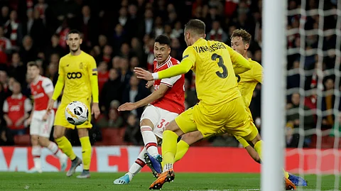 Arsenal's Gabriel Martinelli, second left, scores his side's second goal during the Europa League Group F soccer match between Arsenal and Standard Liege at the Emirates Stadium, in London, Thursday, Oct. 3, 2019.