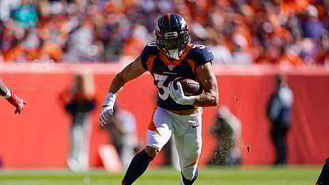 Denver Broncos running back Phillip Lindsay runs with the ball during the first half of an NFL football game against the Tennessee Titans, Sunday, Oct. 13, 2019, in Denver. (AP Photo/Jack Dempsey)