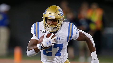 UCLA running back Joshua Kelley (27) runs for a first down against Arizona in the second half during an NCAA college football game, Saturday, Sept. 28, 2019, in Tucson, Ariz. Arizona defeated UCLA 20-17.