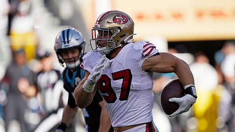 San Francisco 49ers defensive end Nick Bosa runs with the ball after making an interception during the second half of an NFL football game against the Carolina Panthers in Santa Clara, Calif., Sunday, Oct. 27, 2019. (AP Photo/Tony Avelar)