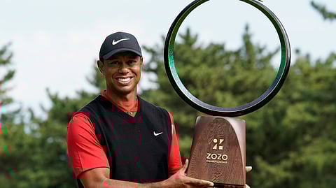 Tiger Woods of the United States poses with his trophy after winning the Zozo Championship PGA Tour at the Accordia Golf Narashino country club in Inzai, east of Tokyo, Japan, Monday, Oct. 28, 2019.