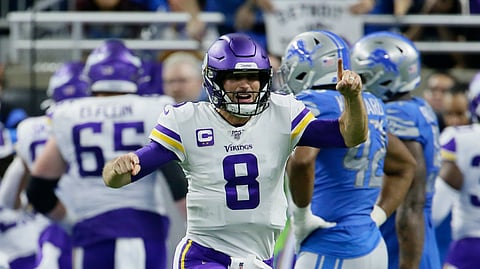 Minnesota Vikings quarterback Kirk Cousins (8) reacts after a touchdown by running back Dalvin Cook during the second half of an NFL football game against the Detroit Lions, Sunday, Oct. 20, 2019, in Detroit.