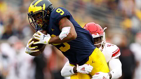 Michigan wide receiver Donovan Peoples-Jones (9) tries to break the tackle of Rutgers defensive back Tre Avery (4) in the first half of an NCAA college football game in Ann Arbor, Mich., Saturday, Sept. 28, 2019. (AP Photo/Paul Sancya)
