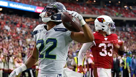 Seattle Seahawks running back C.J. Prosise (22) scores a touchdown against the Arizona Cardinals during the second half of an NFL football game, Sunday, Sept. 29, 2019, in Glendale, Ariz.