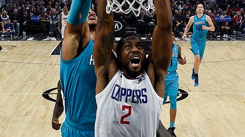 Los Angeles Clippers forward Kawhi Leonard, front, attempts a shot while Charlotte Hornets forward Miles Bridges defends during the first half an NBA basketball game in Los Angeles, Monday, Oct. 28, 2019.
