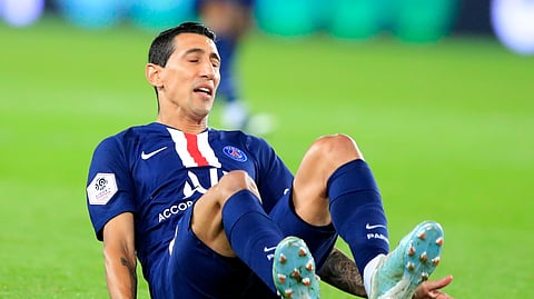 PSG's Angel Di Maria falls on his back during the French League One soccer match between PSG and Reims at the Parc des Princes stadium in Paris, Wednesday, Sept. 25, 2019. (AP Photo/Michel Euler)