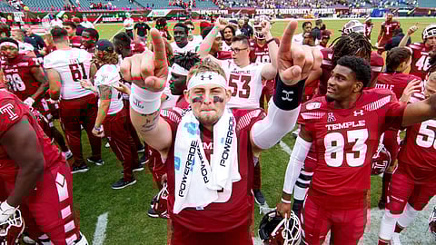 Temple quarterback Anthony Russo (15) celebrates with teammates after their 30-28 win over Memphis in an NCAA college football, Saturday, Oct. 12, 2019, in Philadelphia.