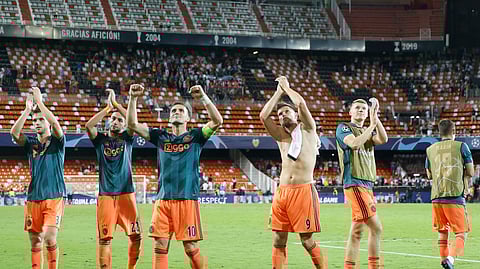Ajax players celebrate their victory after the Champions League group H soccer match between Valencia and Ajax, at the Mestalla stadium in Valencia, Spain, Wednesday, Oct. 2, 2019. (AP Photo/Alberto Saiz)