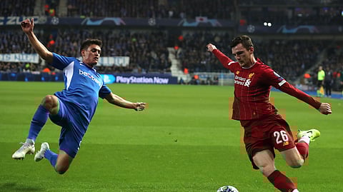 Liverpool's Andrew Robertson, right, vies for the ball against Genk's Bryan Heynen during a Champions League group E soccer match between Genk and Liverpool at the KRC Genk Arena in Genk, Belgium, Wednesday, Oct. 23, 2019.