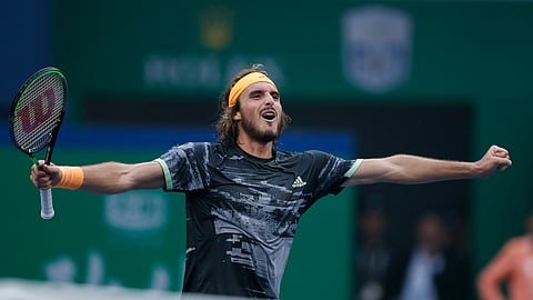 Stefanos Tsitsipas of Greece celebrates after defeating Novak Djokovic of Serbia in the men's singles quarterfinals match at the Shanghai Masters tennis tournament at Qizhong Forest Sports City Tennis Center in Shanghai, China, Friday, Oct. 11, 2019.