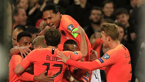 Netherlands' players celebrate their second goal during the Euro 2020 group C qualifying soccer match between The Netherlands and Northern Ireland at De Kuip stadium in Rotterdam, Netherlands, Thursday, Oct. 10, 2019. (AP Photo/Peter Dejong)