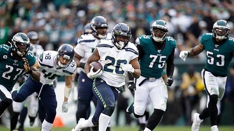 Seattle Seahawks' Rashaad Penny (20) runs for a touchdown during the second half of an NFL football game against the Philadelphia Eagles, Sunday, Nov. 24, 2019, in Philadelphia.