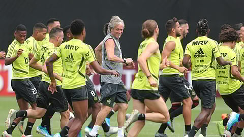 Brazil's Flamengo Coach Jorge Jesus, center, runs with his players during a training session on the pitch of the Peruvian Soccer Federation, in Lima, Peru, Friday, Nov. 22, 2019. Flamengo will play Argentina's River Plate in the Copa Libertadores final match on Saturday. (AP Photo/Martin Mejia)