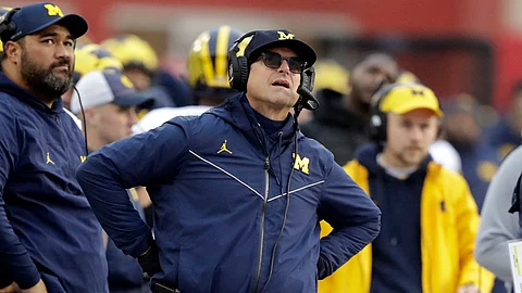 Michigan head coach Jim Harbaugh really, really, really needs a win against Ohio St. (AP Photo/Darron Cummings)