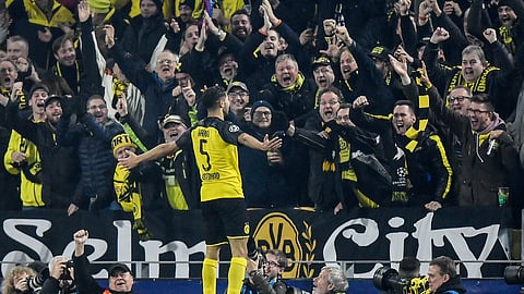 Dortmund's Achraf Hakimi celebrates after scoring his side's third goal during the Champions League group F soccer match between Borussia Dortmund and Inter Milan, in Dortmund, Germany, Tuesday, Nov. 5, 2019. Dortmund defeated Inter with 3-2. (AP Photo/Martin Meissner)