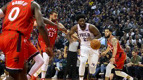Philadelphia 76ers' Joel Embiid drives against the Toronto Raptors during the first half of an NBA basketball game in Toronto, Monday, Nov. 25, 2019.