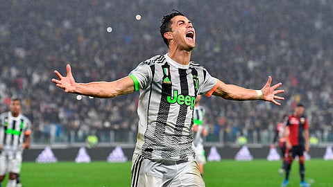 Juventus' Cristiano Ronaldo celebrates after scoring during the Italian Serie A soccer match between Juventus and Genoa at the Allianz stadium in Turin, Italy, Wednesday, Oct. 30, 2019. (Alessandro Di Marco/ANSA via AP)