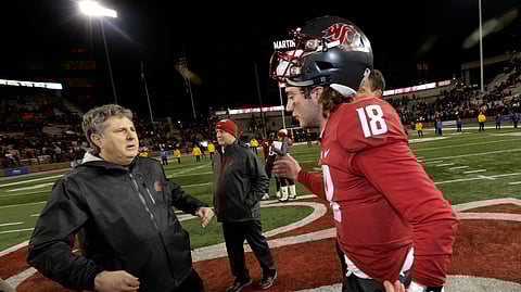 Washington State quarterback Anthony Gordon, right, moves to hug coach Mike Leach after the team's 54-53 win over Oregon State in an NCAA college football game, Saturday, Nov. 23, 2019, in Pullman, Wash. (AP Photo/Ted S. Warren)