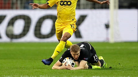 Frankfurt's Martin Hinteregger, right, and Standard's Mehdi Carcela fight for the ball during the Europa League Group F soccer match between Eintracht Frankfurt and Standard Liege in the Commerzbank Arena in Frankfurt, Germany, Thursday, Oct.24, 2019.