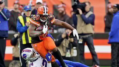 Cleveland Browns running back Nick Chubb, top, is tackled by Buffalo Bills cornerback Taron Johnson during the second half of an NFL football game, Sunday, Nov. 10, 2019, in Cleveland.