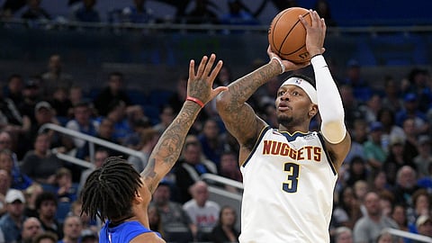 Denver Nuggets forward Torrey Craig (3) shoots in front of Orlando Magic guard Markelle Fultz (20) during the first half of an NBA basketball game, Saturday, Nov. 2, 2019, in Orlando, Fla. (AP Photo/Phelan M. Ebenhack)