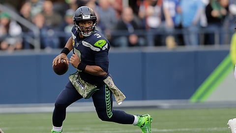 Seattle Seahawks quarterback Russell Wilson scrambles against the Tampa Bay Buccaneers during the second half of an NFL football game, Sunday, Nov. 3, 2019, in Seattle. (AP Photo/John Froschauer)