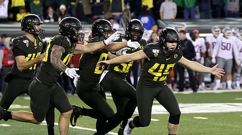 Oregon kicker Camden Lewis, right, begins the celebration after his game winning field goal against Washington State in an NCAA college football game Saturday, Oct. 26, 2019, in Eugene, Ore. (AP Photo/Chris Pietsch)