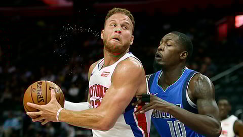 Detroit Pistons forward Blake Griffin (23) goes to the basket against Dallas Mavericks forward Dorian Finney-Smith (10) during the first half of an NBA preseason basketball game Wednesday, Oct. 9, 2019, in Detroit.