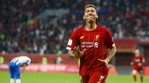 Liverpool's Roberto Firmino celebrates after a goal after the Club World Cup semifinal soccer match between Liverpool and Monterrey at the Khalifa International Stadium in Doha, Qatar, Wednesday, Dec. 18, 2019. (AP Photo/Hussein Sayed)