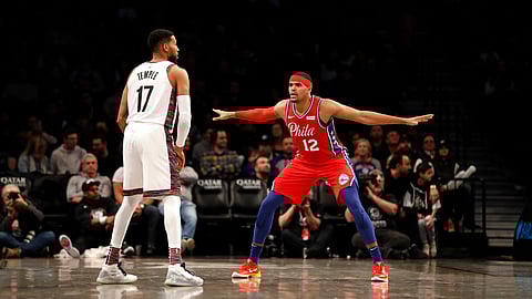 Philadelphia 76ers forward Tobias Harris (12) defends against Brooklyn Nets guard Garrett Temple (17) during the third quarter of an NBA basketball game at Barclays Center, Sunday, Dec. 15, 2019, in New York.
