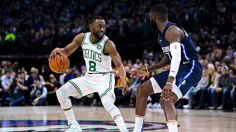 Boston Celtics guard Kemba Walker (8) controls the ball as Dallas Mavericks guard Tim Hardaway Jr. (11) defends during the first half of an NBA basketball game Wednesday, Dec. 18, 2019, in Dallas. (AP Photo/Sam Hodde)