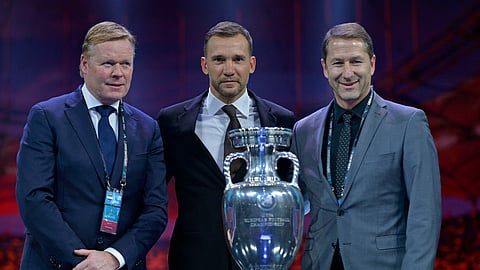 Netherlands coach Ronald Koeman, Ukraine coach Andriy Shevchenko and Austria coach Franco Foda pose for a photo during the draw for the UEFA Euro 2020 soccer tournament finals in Bucharest, Romania, Saturday, Nov. 30, 2019.