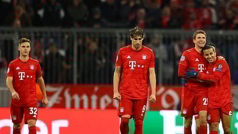 Bayern's Thomas Mueller, 2nd right, celebrates with teammates after scoring his sides second goal during the Champions League group B soccer match between Bayern Munich and Tottenham Hotspur at the Allianz Arena stadium, in Munich, Wednesday, Dec. 11, 2019. (AP Photo/Matthias Schrader)