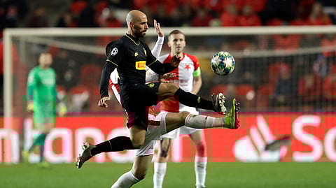 Inter Milan's Borja Valero, front, kicks the ball during the Champions League group F soccer match between Slavia Praha and Inter Milan at the Sinobo stadium in Prague, Czech Republic, Wednesday, Nov. 27, 2019.