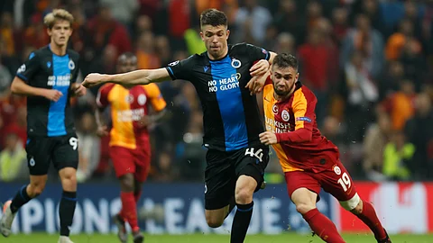 Galatasaray's Omer Bayram, right, fights for the ball with Brugge's Brandon Mechele during the Champions League group A soccer match between Galatasaray and Club Brugge in Istanbul, Tuesday, Nov. 26, 2019.