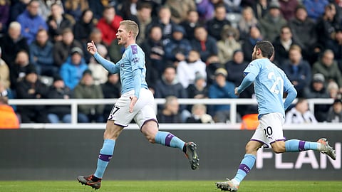 Manchester City's Kevin De Bruyne, left, celebrates scoring his side's second goal of the game during the English Premier League soccer match between Newcastle United and Manchester City at St James' Park, Newcastle, England, Saturday, Nov. 30, 2019.