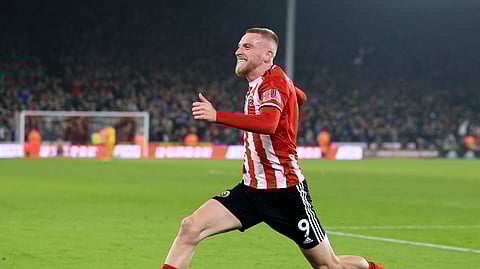 Sheffield United's Oliver McBurnie celebrates after scoring his side's third goal during the English Premier League soccer match between Sheffield United and Manchester United at Bramall Lane Stadium in Sheffield, England, Sunday, Nov. 24, 2019.