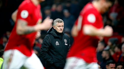 Manchester United manager Ole Gunnar Solskjaer, centre, watches the action from the touchline, during the English Premier League soccer match between Manchester United and Burnley, at Old Trafford, in Manchester, England, Wednesday, Jan. 22, 2020.