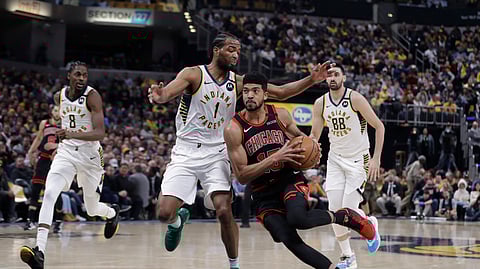 Chicago Bulls' Chandler Hutchison (15) goes to the basket against Indiana Pacers' T.J. Warren (1) during the first half of an NBA basketball game Wednesday, Jan. 29, 2020, in Indianapolis.