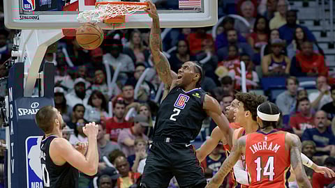 Los Angeles Clippers forward Kawhi Leonard (2) dunks against New Orleans Pelicans center Jaxson Hayes (10) in the second half an NBA basketball game in New Orleans, Saturday, Jan. 18, 2020.