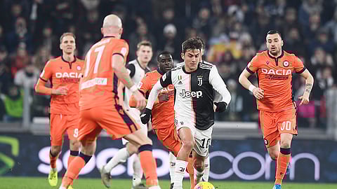 Juventus' Paulo Dybala , center right, fights for the ball with Udinese's Bram Nuytinck, center, during the Italian Cup soccer match between Juventus and Udinese, at the Allianz Stadium in Turin, Italy, Wednesday, Jan. 15, 2020.