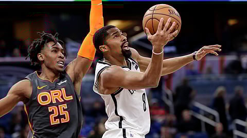 Brooklyn Nets guard Spencer Dinwiddie (8) shoots in front of Orlando Magic forward Wes Iwundu (25) during the second half of an NBA basketball game, Monday, Jan. 6, 2020, in Orlando, Fla.