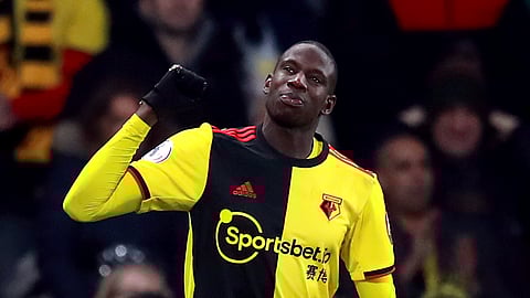 Watford's Abdoulaye Doucoure celebrates scoring his side's second goal of the game, during the English Premier League soccer match between Watford and Wolverhampton Wanderers at Vicarage Road, in Watford, England, Wednesday, Jan. 1, 2020. (Adam Davy/PA via AP)
