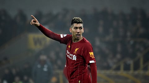 Liverpool's Roberto Firmino gestures during the English Premier League soccer match between Wolverhampton Wanderers and Liverpool at the Molineux Stadium in Wolverhampton, England, Thursday, Jan. 23, 2020.