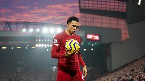 Liverpool's Trent Alexander-Arnold holds the ball during the English Premier League soccer match between Liverpool and Manchester United at Anfield Stadium in Liverpool, Sunday, Jan. 19, 2020.