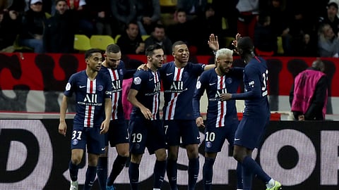 PSG's Kylian Mbappe, center, celebrates with teammates after scoring his side's fourth goal during the French League One soccer match between Monaco and Paris Saint-Germain at the Louis II stadium in Monaco, Wednesday, Jan. 15, 2019.