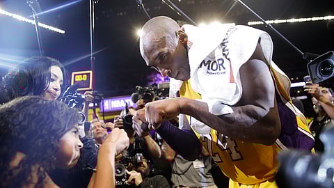 In this April 13, 2016 file photo Los Angeles Lakers' Kobe Bryant, right, fist-bumps his daughter Gianna after the last NBA basketball game of his career, against the Utah Jazz in Los Angeles. Bryant, the 18-time NBA All-Star who won five championships and became one of the greatest basketball players of his generation during a 20-year career with the Los Angeles Lakers, died in a helicopter crash Sunday, Jan. 26, 2020. Gianna also died in the crash.