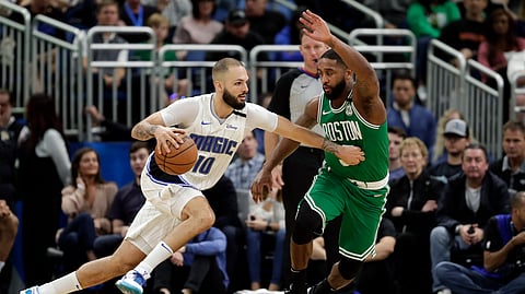 Orlando Magic guard Evan Fournier (10) drives to the basket against Boston Celtics guard Brad Wanamaker during the second half of an NBA basketball game, Friday, Jan. 24, 2020, in Orlando, Fla. (AP Photo/John Raoux)