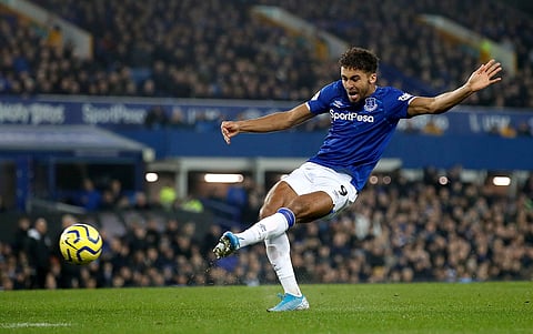 Everton's Dominic Calvert-Lewin scores his side's second goal of the game against Newcastle United during their English Premier League soccer match at Goodison Park in Liverpool, England, Tuesday Jan. 21, 2020. (Martin Rickett/PA via AP)